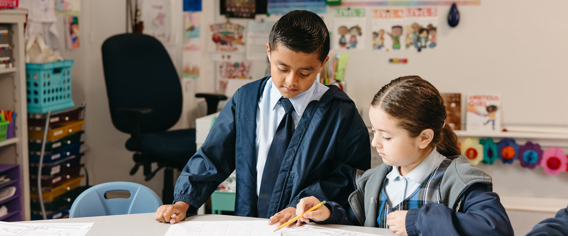 Two St. Raphael students working on assignment