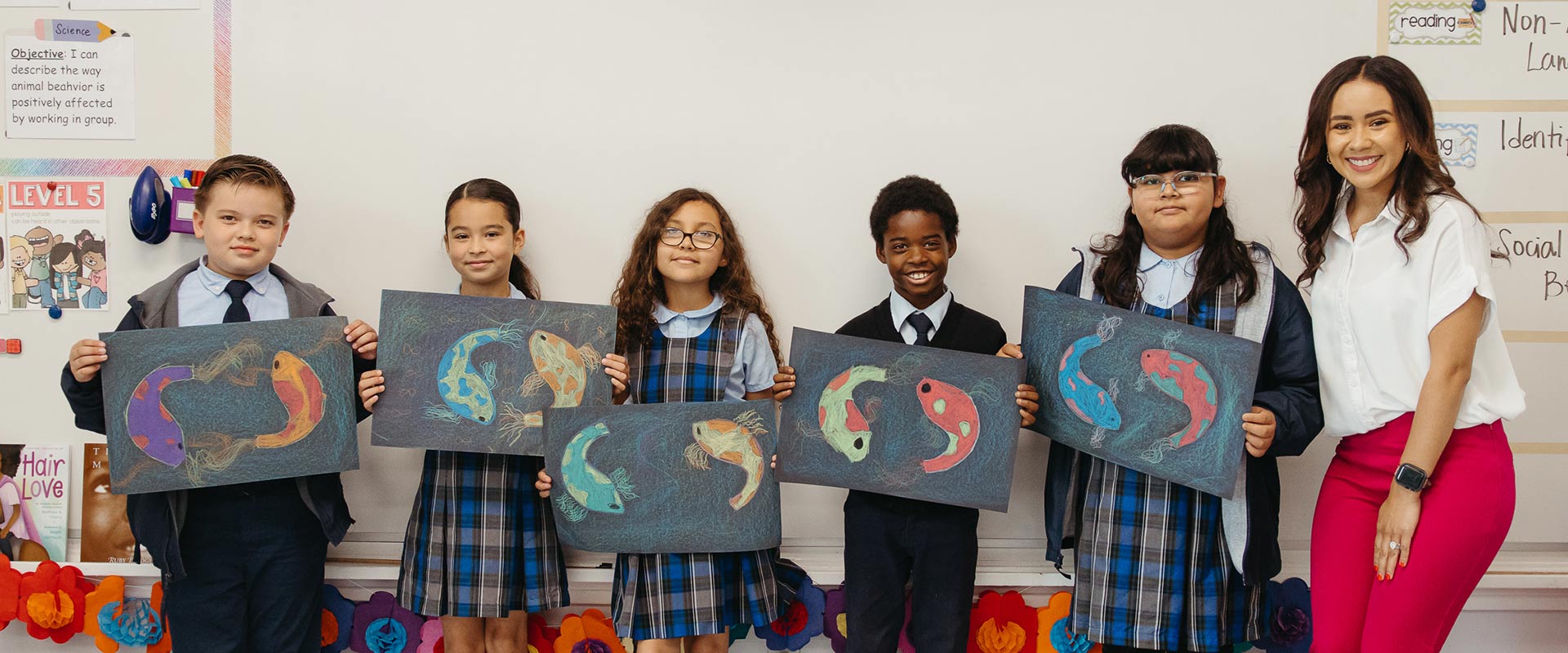 St. Raphael students showing their artwork