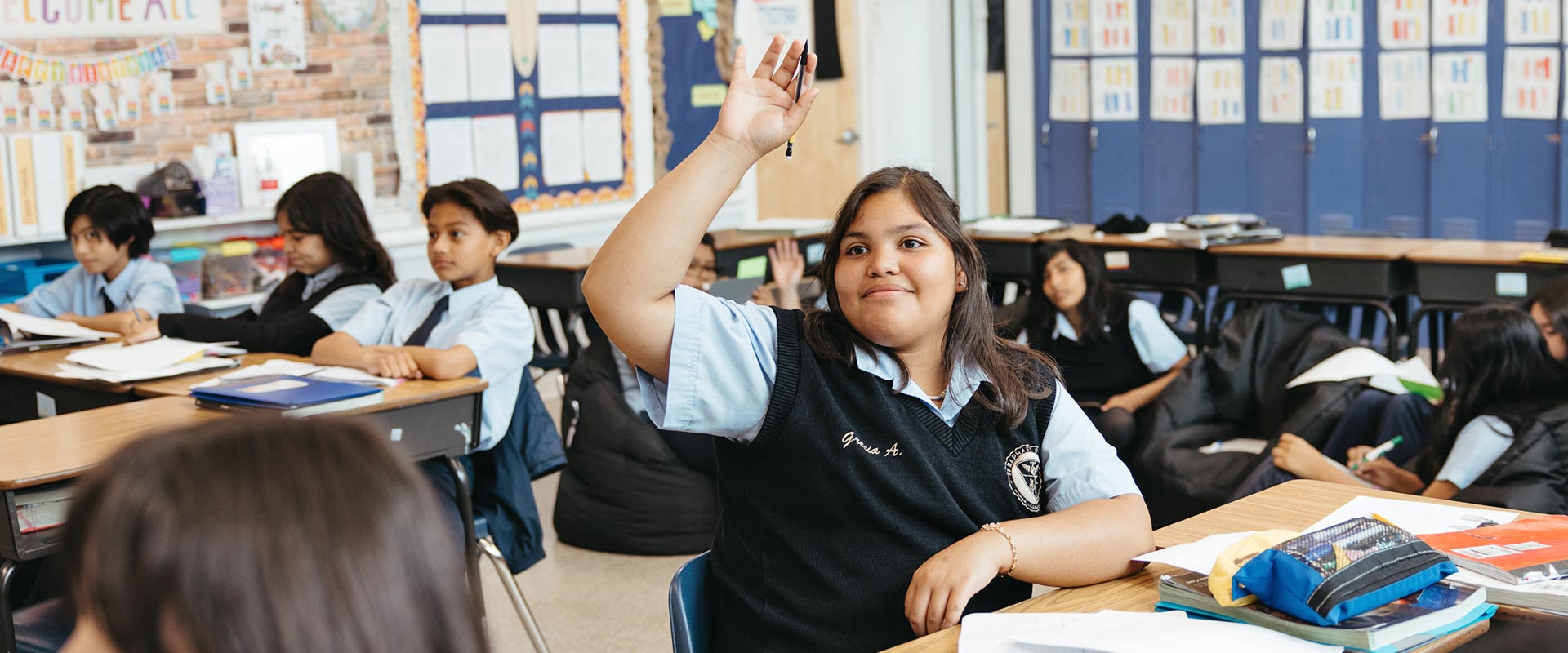 St. Raphael student raising hand to ask question