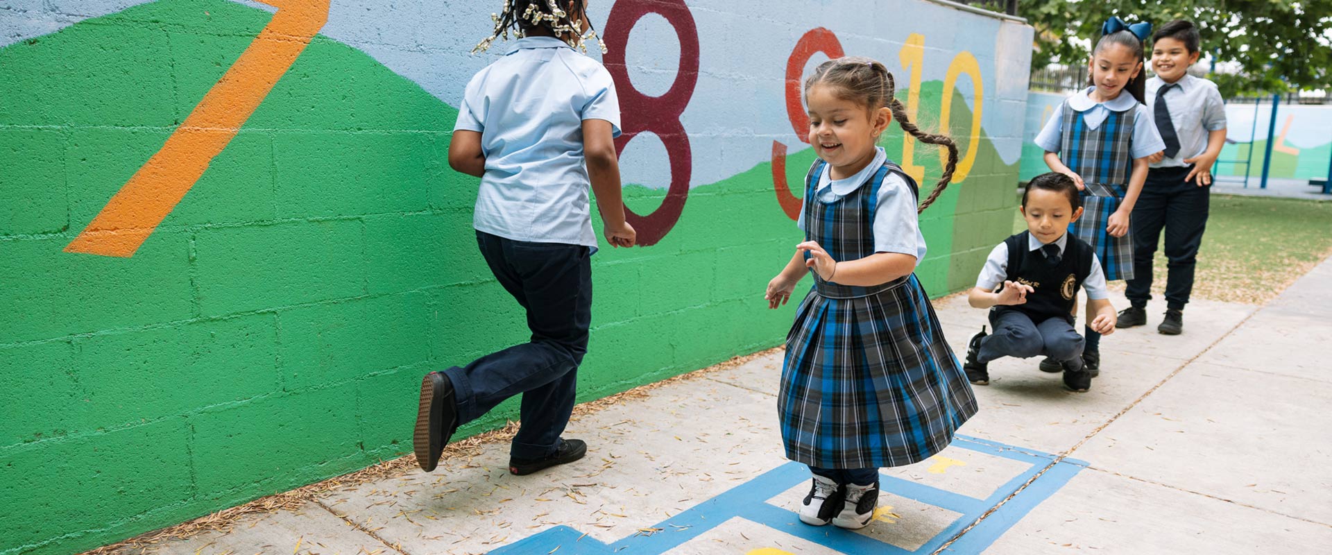 St. Raphael students playing hopscotch on playground