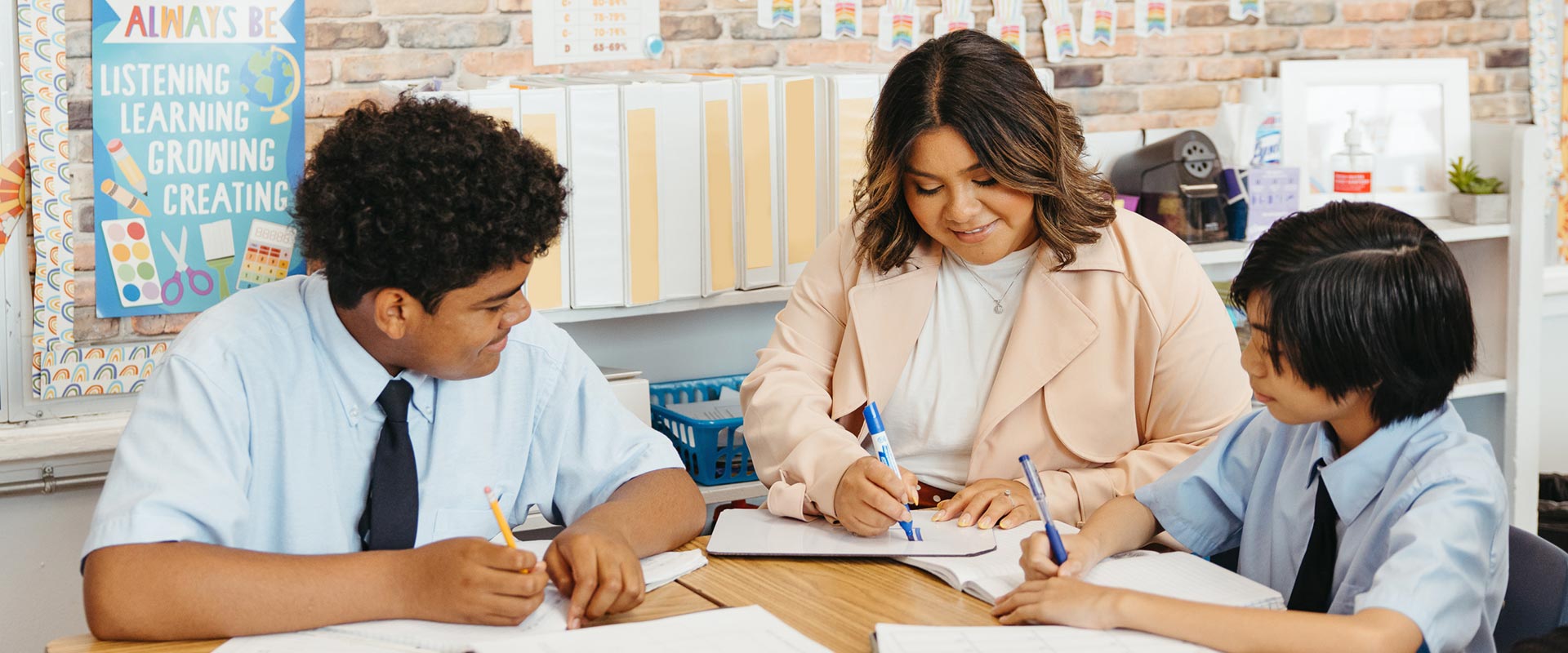 Teacher working with students