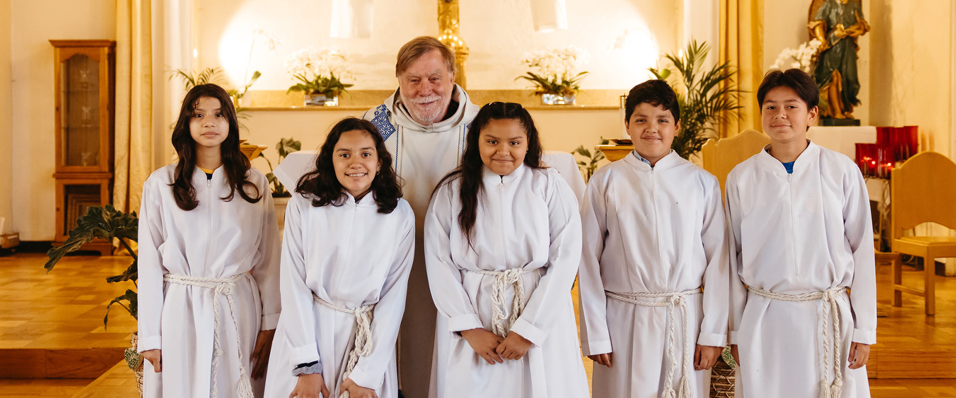 Father Stan with altar servers