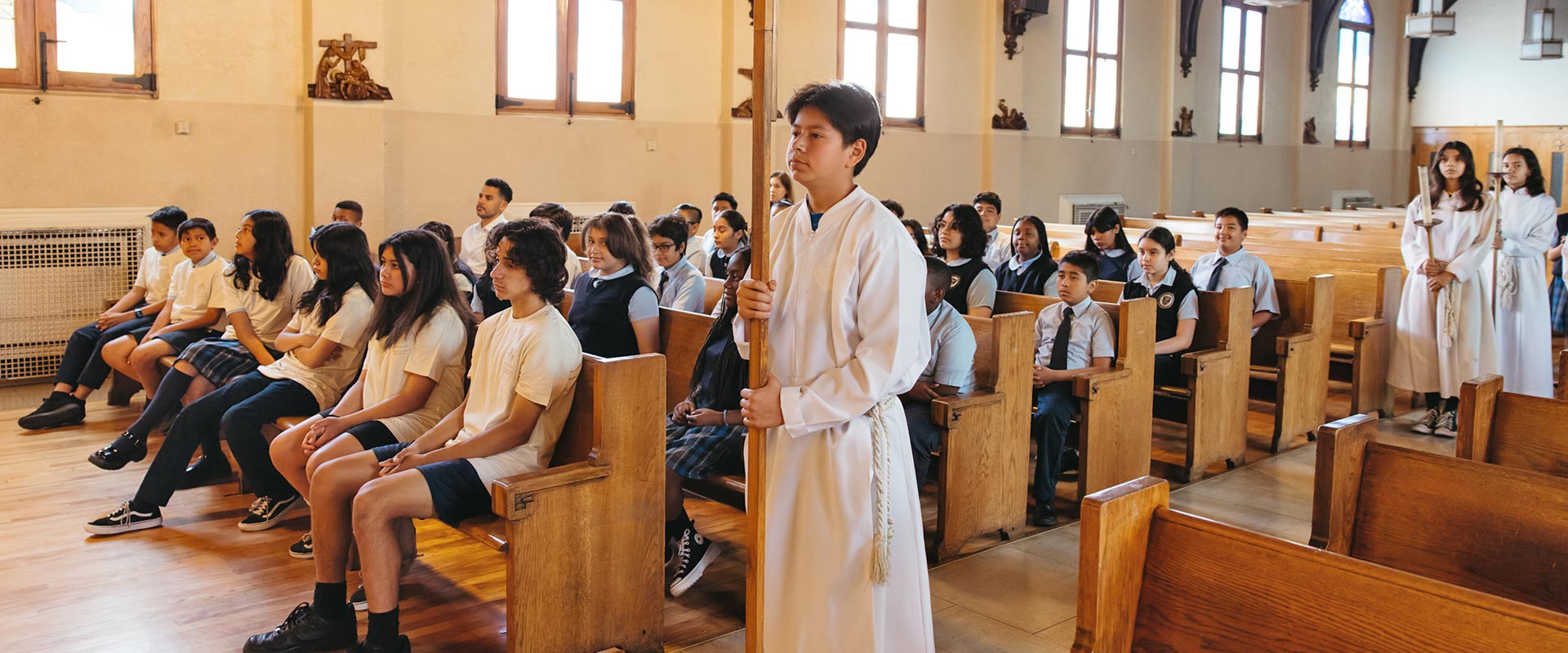 Altar servers and students during mass