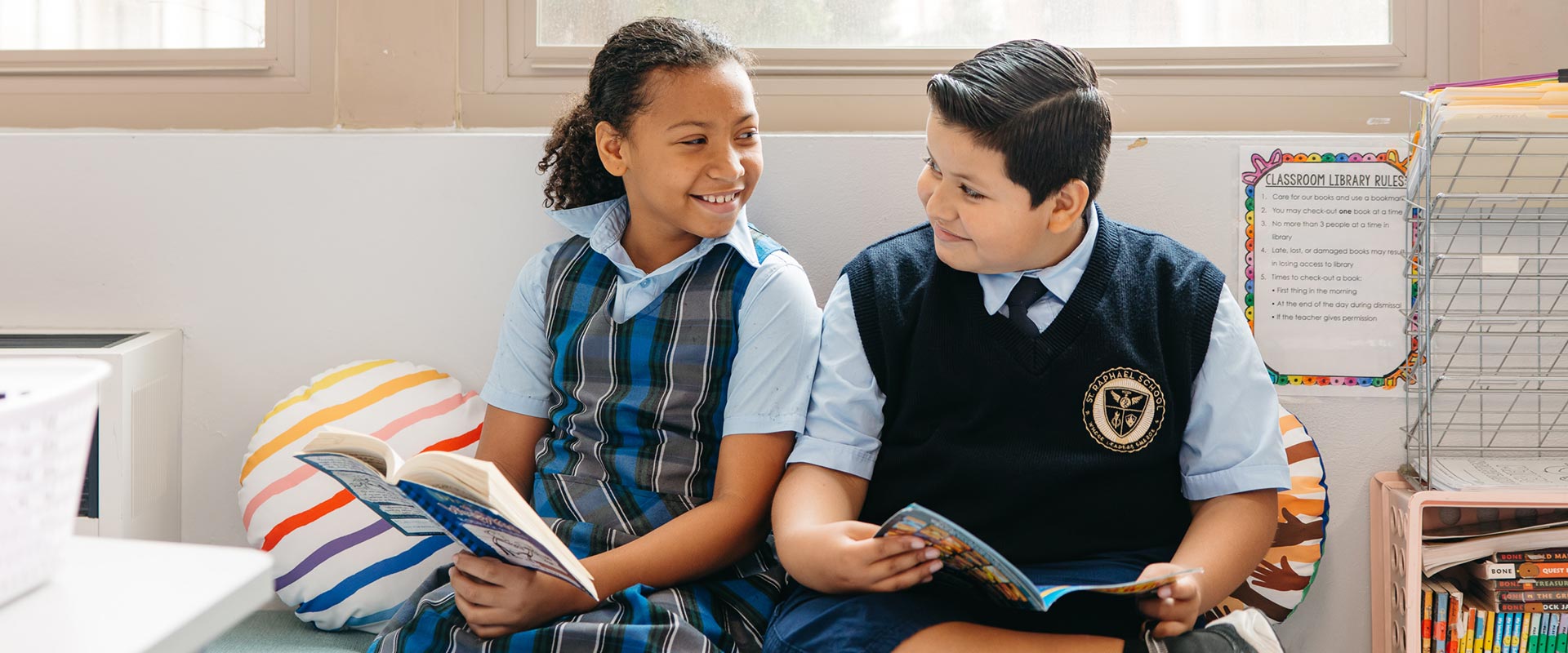 Two St. Raphael students read together